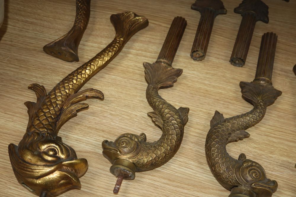 Two sets of four gilt metal dolphin supports, longest excluding screw thread 39cm